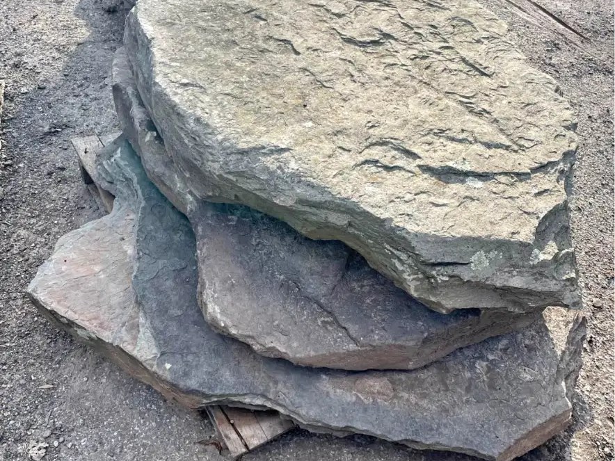 Stacked natural stone slabs used as steps