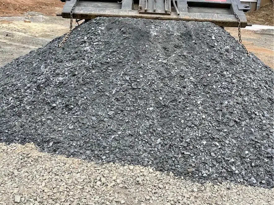 Quarry process stone being dumped from a truck at a New Jersey job site